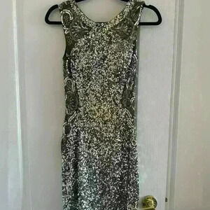 Woman’s mini beaded  silver dress in size x-small